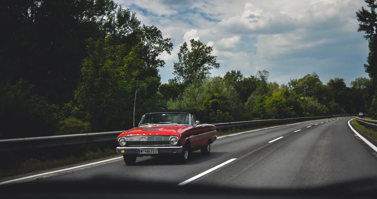 A classic car on a country road
